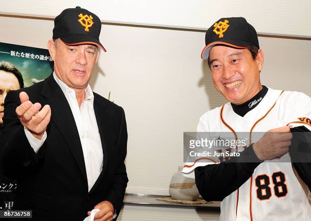 Yomiuri Giants coach Tatsunori Hara and actor Tom Hanks meet press at the reception room during professional baseball match between Yomiuri Giants...