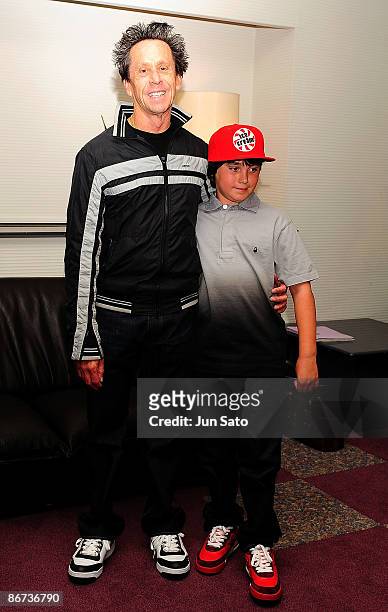 Producer Brian Grazer and his son Thomas Grazer pose at reception room during the ceremonial first pitch prior to the professional baseball match...