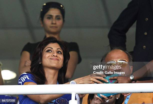 Bollywood actress and co-owner of the IPL team Rajasthan Royals, Shilpa Shetty, gives her autograph to a fan at an IPL match between Rajastan Royals...