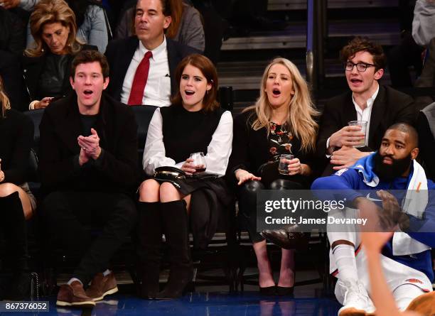 Jack Brooksbank, Princess Eugenie of York, Ellie Goulding and Caspar Jopling attend the Brooklyn Nets Vs New York Knicks game at Madison Square...