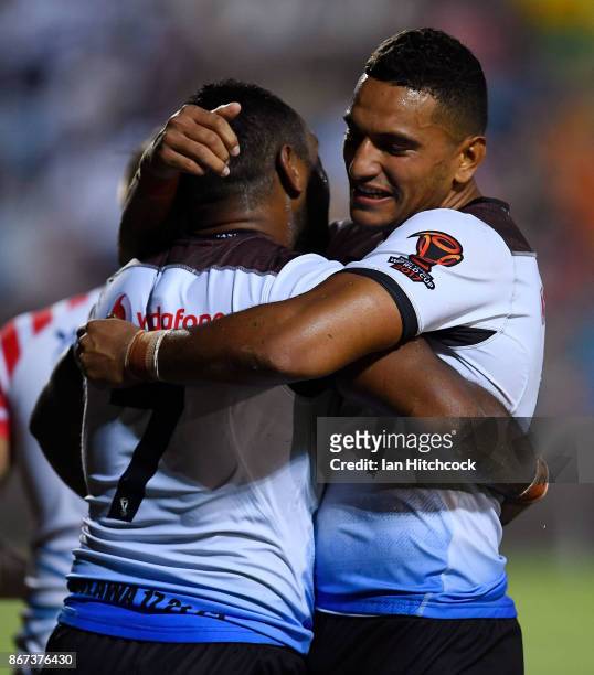 Henry Raiwalui of Fiji celebrates after scoring a try with Marcelo Montoya of Fiji during the 2017 Rugby League World Cup match between Fiji and the...