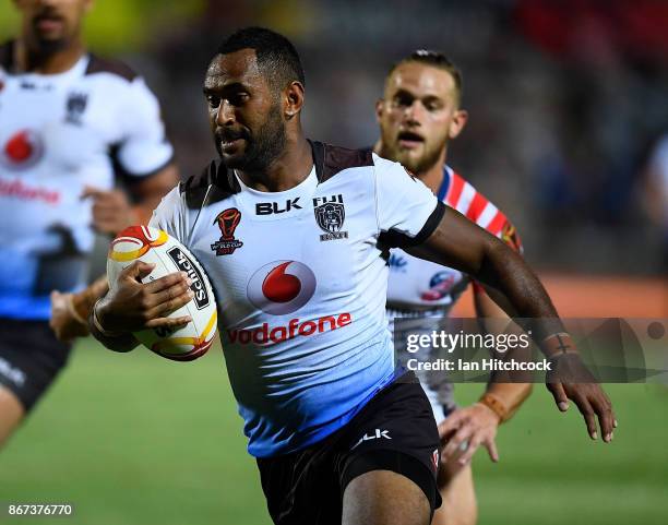 Henry Raiwalui of Fiji makes a break to score a try during the 2017 Rugby League World Cup match between Fiji and the United States on October 28,...