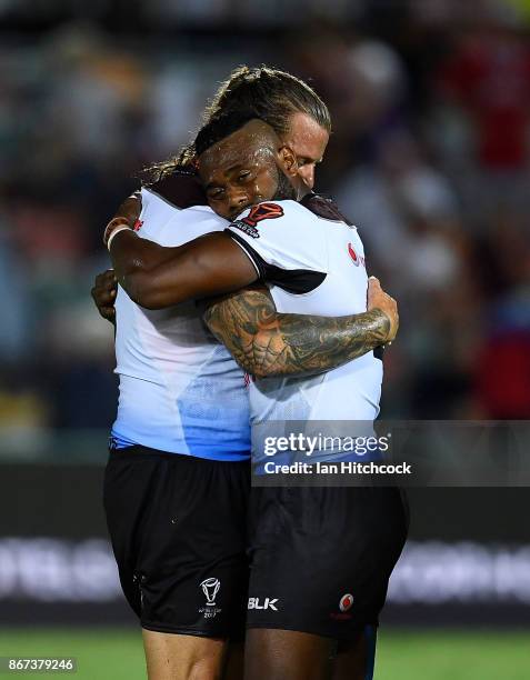 Akuila Uate of Fiji embraces Ashton Sims of Fiji after winning the 2017 Rugby League World Cup match between Fiji and the United States on October...
