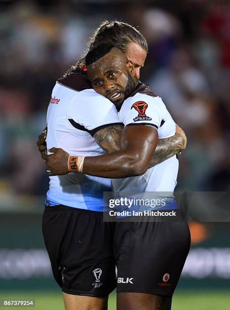 Akuila Uate of Fiji embraces Ashton Sims of Fiji after winning the 2017 Rugby League World Cup match between Fiji and the United States on October...