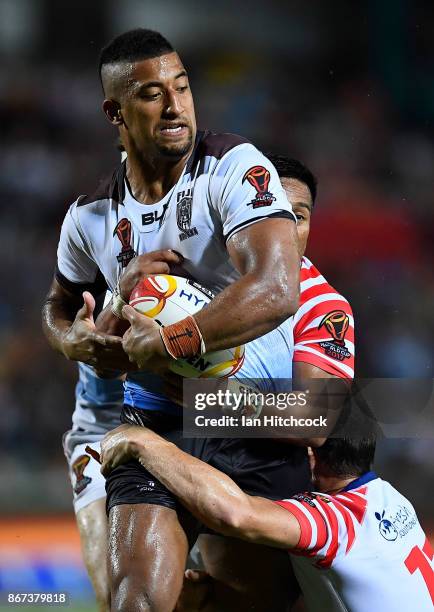 Viliame Kikau of Fiji is wrapped up by the USA defence during the 2017 Rugby League World Cup match between Fiji and the United States on October 28,...