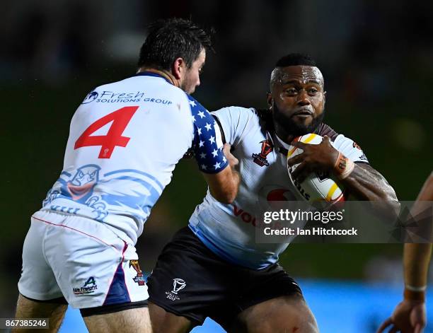 Akuila Uate of Fiji is tackled by Jonathan Alley of the USA during the 2017 Rugby League World Cup match between Fiji and the United States on...