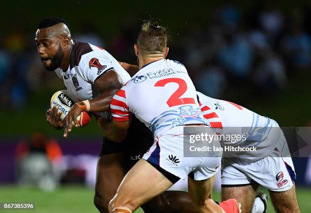 Akuila Uate of Fiji is tackled by Ryan Burroughs of the USA during the 2017 Rugby League World Cup match between Fiji and the United States on...