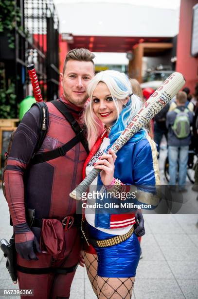 Deadpool cosplayer and Harley Quinn cosplayer during MCM London Comic Con 2017 held at the ExCel on October 28, 2017 in London, England.