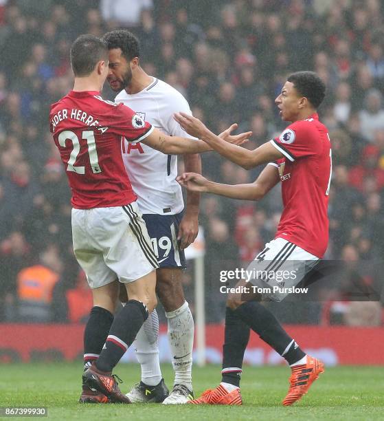 Ander Herrera of Manchester United clashes with Mousa Dembele of Tottenham Hotspur during the Premier League match between Manchester United and...