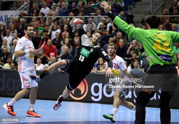 Hendrik Pekeler of Germany scores against goalkeeper Rodrigo Corrales of Spain during the international friendly match between Germany and Spain at...