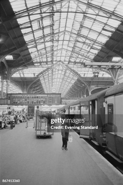 Man walks down a platform at Liverpool Street Station, London, UK, 8th September 1978.