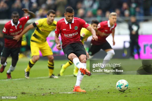 Jonathas of Hannover scores a penalty goal to make it 1:0 during the Bundesliga match between Hannover 96 and Borussia Dortmund at HDI-Arena on...