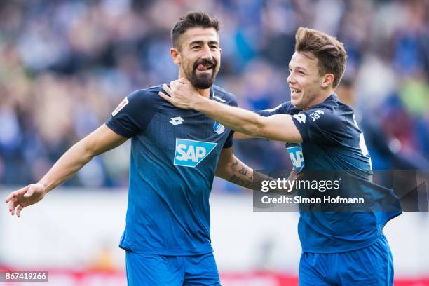 Kerem Demirbay of Hoffenheim celebrates his team's first goal with team mate Dennis Geiger during the Bundesliga match between TSG 1899 Hoffenheim...