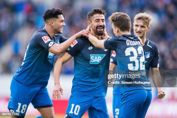Kerem Demirbay of Hoffenheim celebrates his team's first goal with team mates Dennis Geiger , Stefan Posch and Nadiem Amiri during the Bundesliga...