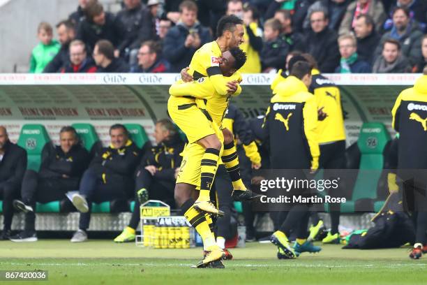 Dan-Axel Zagadou of Dortmund ) celebrates with Pierre-Emerick Aubameyang of Dortmund after he scored a goal to make it 1:1 during the Bundesliga...