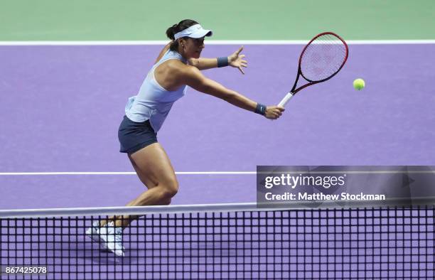 Caroline Garcia of France volleys in her singles semi final match against Venus Williams of the United States during day 7 of the BNP Paribas WTA...