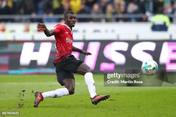 Ihlas Bebou of Hannover shoots to score his teams second goal to make it 2:1 during the Bundesliga match between Hannover 96 and Borussia Dortmund at...