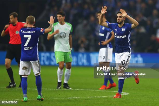Nabil Bentaleb of Schalke 04 celebrates scoring his teams first goal of the game with team mate Max Meyer during the Bundesliga match between FC...
