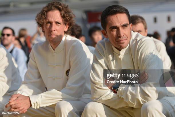 Koen DE KORT and Alberto CONTADOR from TrekSegafredo team wear traditional Chinese dresses, during the 1st TDF Shanghai Criterium 2017 - Media Day....