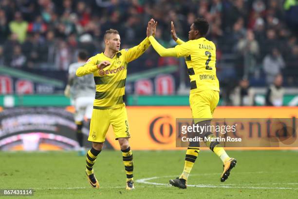 Andrej Yarmolenko of Dortmund celebrates with Dan-Axel Zagadou of Dortmund after he scored his teams second goal to make it 2:2, during the...