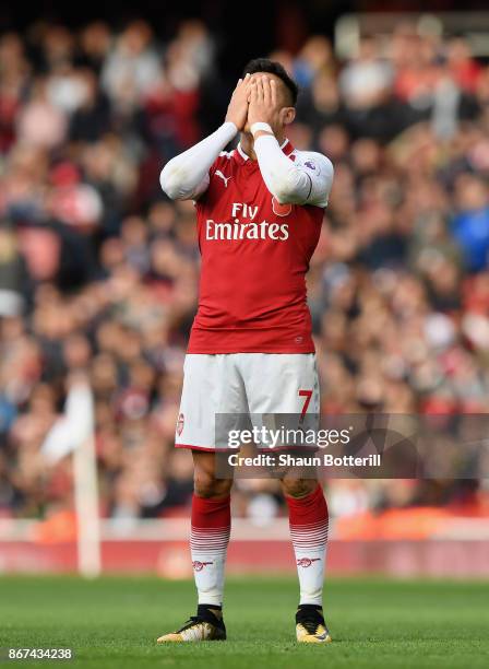 Alexis Sanchez of Arsenal reacts during the Premier League match between Arsenal and Swansea City at Emirates Stadium on October 28, 2017 in London,...