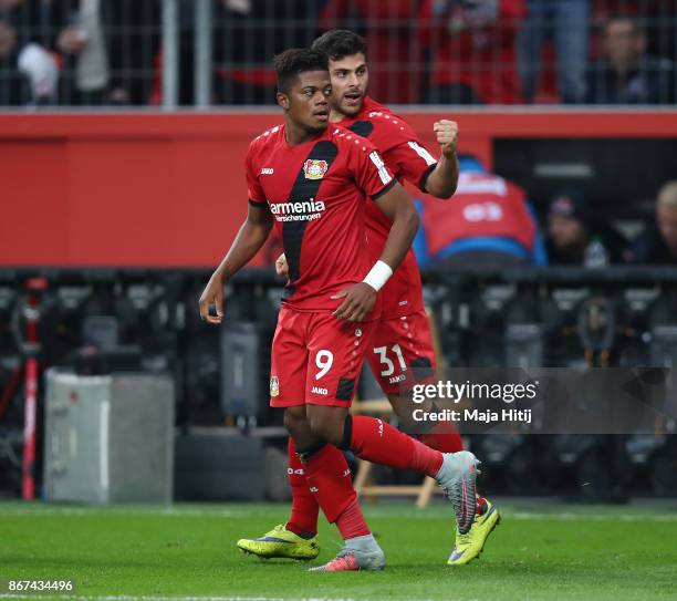 Leon Bailey of Bayer Leverkusen celebrates with Kevin Volland of Bayer Leverkusen after he scored his teams first goal to make it 1:1 during the...
