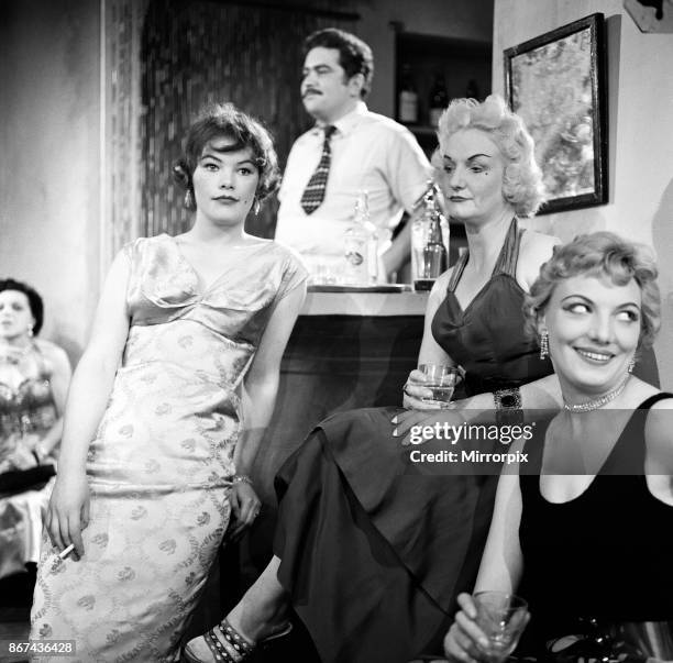 The cast of a new play, 'All Kinds of Men' by Alex Samuels. The play is set in Mme Tina's house of ill fame. Awaiting customers are, left to right,...
