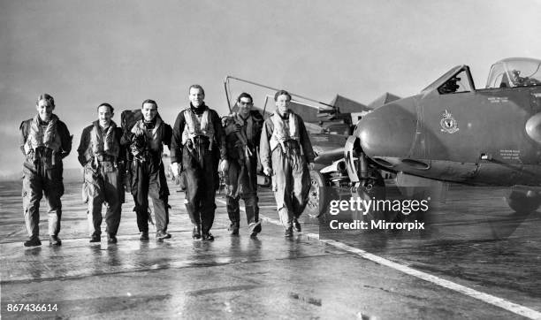 Pilots of 3613 Fighter Control Unit of the Royal Auxiliary Air Force make their way to the briefing room to report on their mission at Bowlee, 11th...