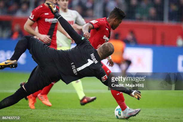 Leon Bailey of Bayer Leverkusen goes past Timo Horn of Koeln to score his teams first goal to make it 1:1 during the Bundesliga match between Bayer...