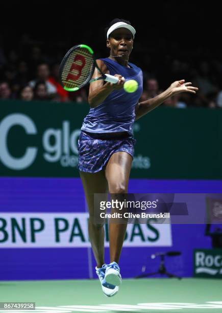 Venus Williams of the United States plays a forehand in her singles semi final match against Caroline Garcia of France during day 7 of the BNP...