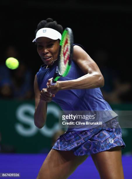 Venus Williams of the United States plays a backhand in her singles semi final match against Caroline Garcia of France during day 7 of the BNP...