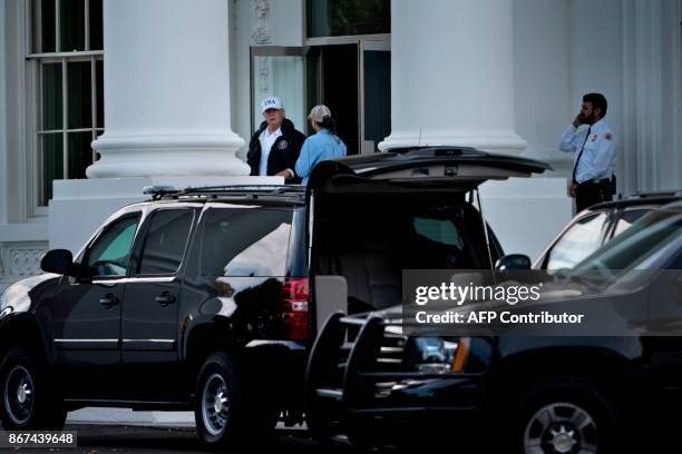 President Donald Trump walks to his motorcade outside the White House in Washington, DC, before traveling to Trump National Golf Course on October...