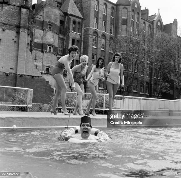 Tommy Cooper opening the Oasis outdoor swimming pool in Holborn for the season. Tommy gets rescued by four women from the Prince of Wales Theatre,...