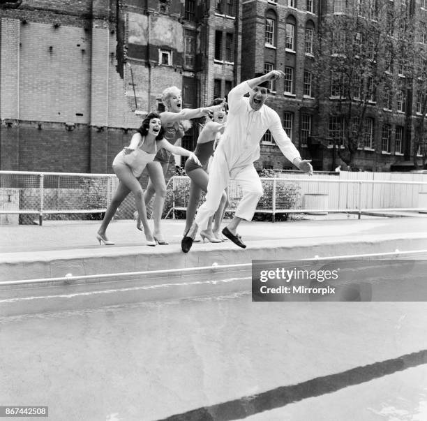 Tommy Cooper opening the Oasis outdoor swimming pool in Holborn for the season. Wearing a boiler suit to keep warm, Tommy gets pushed into the pool...