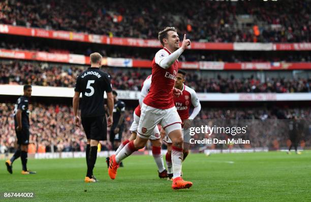 Aaron Ramsey of Arsenal celebrates scoring his sides second goal during the Premier League match between Arsenal and Swansea City at Emirates Stadium...