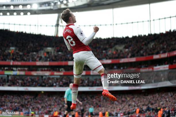 Arsenal's Welsh midfielder Aaron Ramsey celebrates after scoring their second goal during the English Premier League football match between Arsenal...