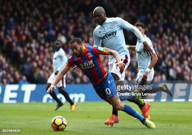 Angelo Ogbonna of West Ham United fouls Andros Townsend of Crystal Palace and a penalty is later awarded during the Premier League match between...