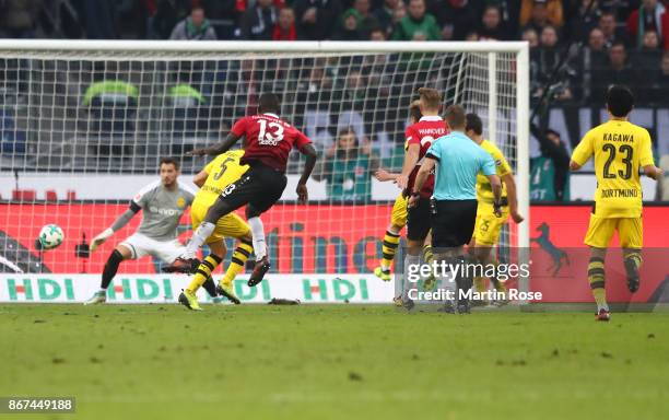 Ihlas Bebou of Hannover scores his teams fought goal to make it 4:2 during the Bundesliga match between Hannover 96 and Borussia Dortmund at...