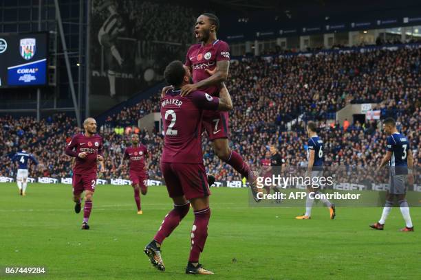 Manchester City's English midfielder Raheem Sterling celebrates scoring the team's third goal with Manchester City's English defender Kyle Walker...