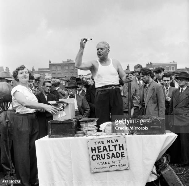 Phil Strong's medicine 'cures all', so he says as he sells it from his stall in Club Row, Bethnal Green, London.
