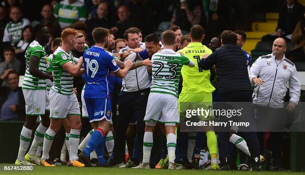 Members of both sides clash resulting in red cards for Olufela Olomola of Yeovil Town and Kevin Toner of Stevenage during the Sky Bet League Two...