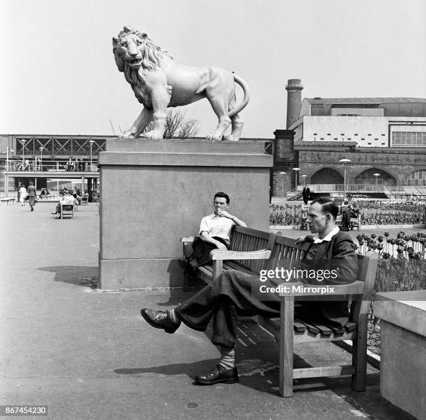 People taking their lunch break at Festival Southbank Gardens, London, 13th May 1954.