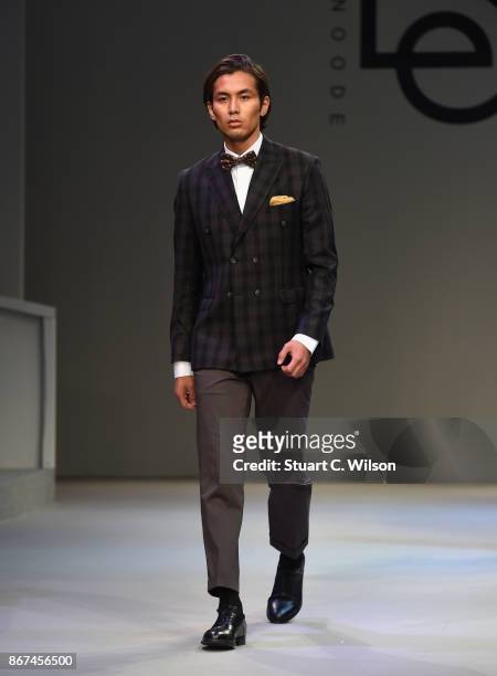 Model walks the runway during the Behnoode Menswear show at Fashion Forward October 2017 held at the Dubai Design District on October 28, 2017 in...