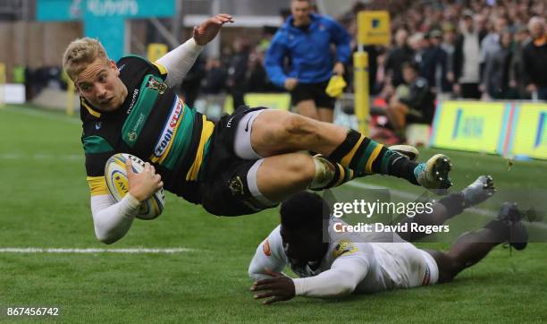 Harry Mallinder of Northampton dives over for a try during the Aviva Premiership match between Northampton Saints and Wasps at Franklin's Gardens on...