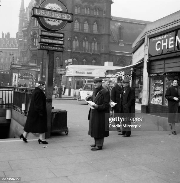 For a week, owing to a trade dispute, Londoners have been without newspapers.: this news vendor at Kings Cross station, did brisk business however in...