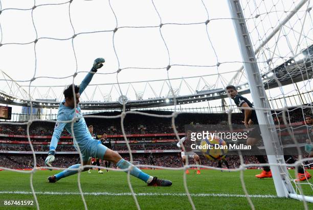 Aaron Ramsey of Arsenal scores his sides second goal past Lukasz Fabianski of Swansea City during the Premier League match between Arsenal and...