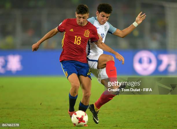 Morgan Gibbs White of England and Cesar Gelabert of Spain in action during the FIFA U-17 World Cup India 2017 Final match between England and Spain...