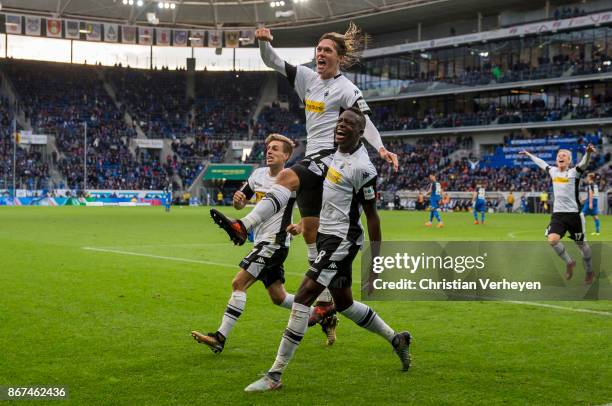 Jannik Vestergaard of Borussia Moenchengladbach celebrates with his team mates Denis Zakaria and Patrick Herrmann after he scores his teams third...