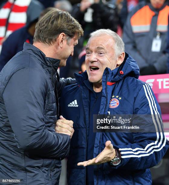 Coach Ralph Hasenhuettl of Leipzig speaks with Hermann Gerland of Bayern Muenchen before the Bundesliga match between FC Bayern Muenchen and RB...