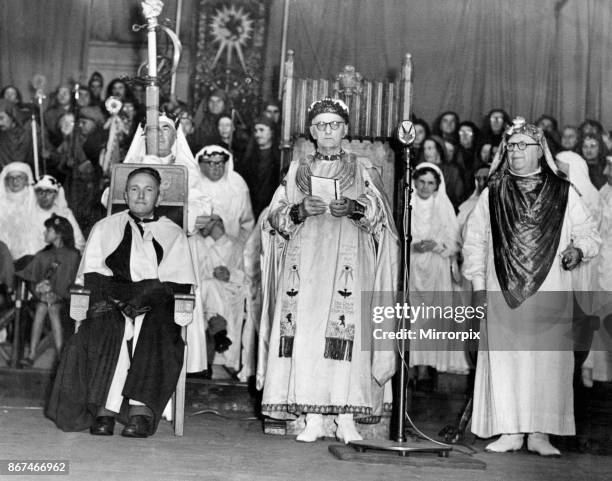 The chaired bard, T Llew Jones of Llandysul, is seated at the chairing ceremony, at the Eisteddfod, Ebbw Vale, 8th August 1958.